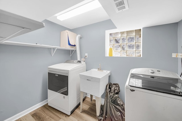 7505 S May St, Chicago, IL 60620 - laundry room with separate washer and dryer and light wood-style floors