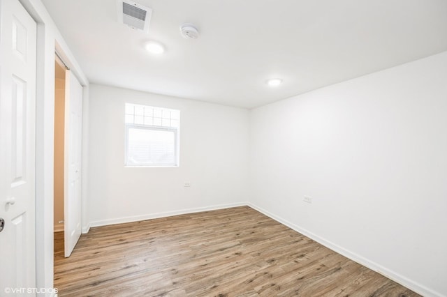 3818 W 107th St, Chicago, IL 60655 - unfurnished bedroom with light wood-style floors and a closet