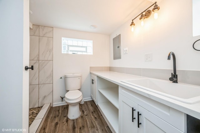 3818 W 107th St, Chicago, IL 60655 - full bath featuring electric panel, vanity, wood finished floors, and tiled shower