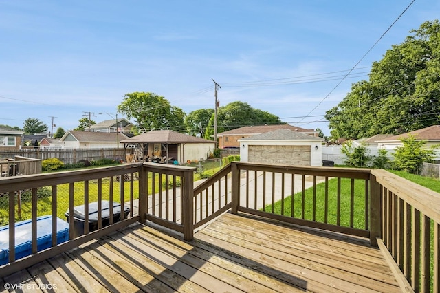 3818 W 107th St, Chicago, IL 60655 - wooden deck with an outdoor structure, a fenced backyard, a residential view, and a detached garage