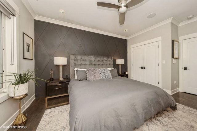 4730 S Champlain Ave Unit 3, Chicago, IL 60615 - bedroom with an accent wall, wood finished floors, crown molding, a closet, and a ceiling fan