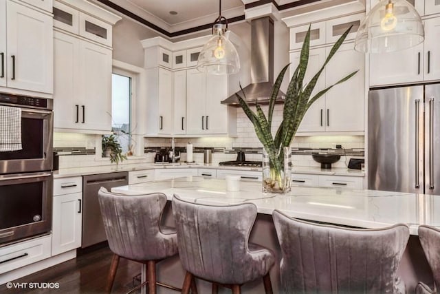 4730 S Champlain Ave Unit 3, Chicago, IL 60615 - kitchen with appliances with stainless steel finishes, wall chimney range hood, ornamental molding, a breakfast bar area, and tasteful backsplash