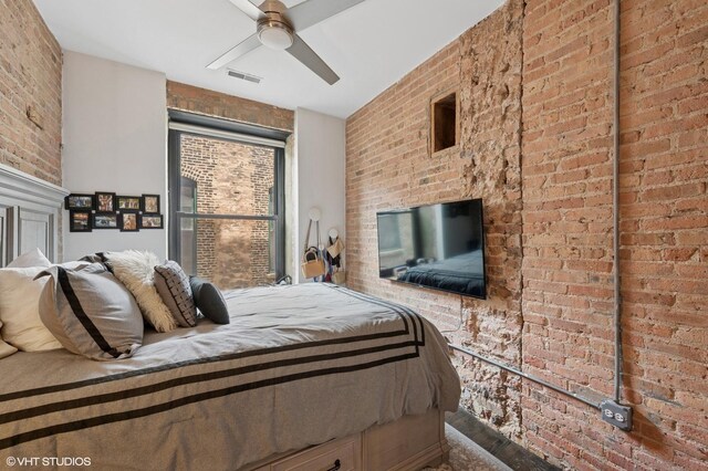 106 N Aberdeen St Unit 3A, Chicago, IL 60607 - bedroom with brick wall and a ceiling fan