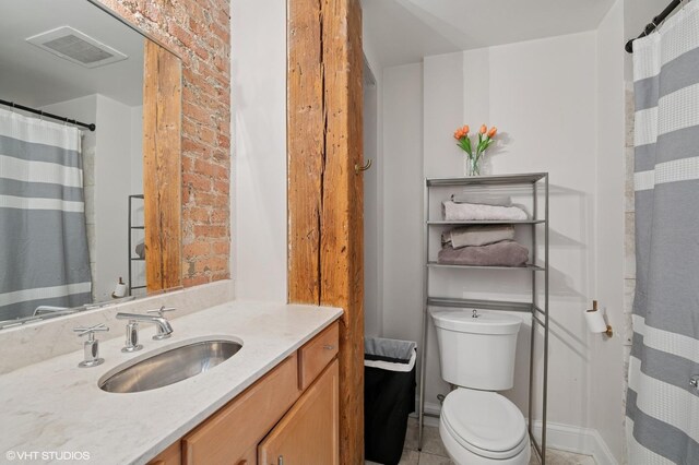 106 N Aberdeen St Unit 3A, Chicago, IL 60607 - bathroom with vanity and tile patterned floors