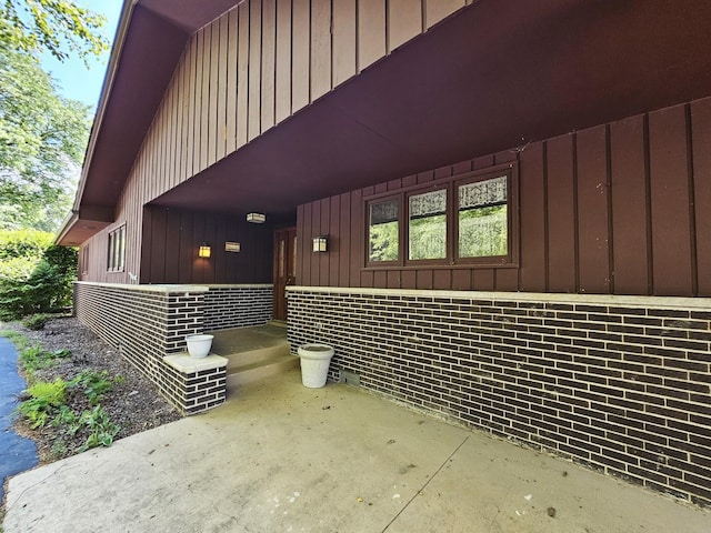 9616 Zimmer Dr, Algonquin, IL 60102 - view of home's exterior featuring board and batten siding, brick siding, and covered porch