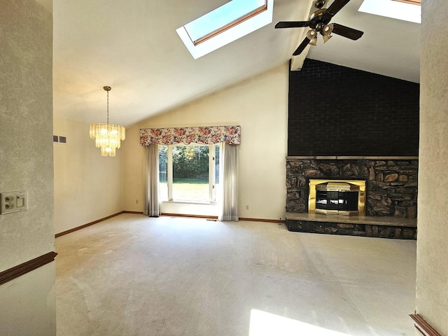9616 Zimmer Dr, Algonquin, IL 60102 - unfurnished living room featuring a chandelier, ceiling fan, a stone fireplace, a skylight, and carpet floors