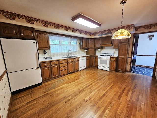 9616 Zimmer Dr, Algonquin, IL 60102 - kitchen featuring white appliances, light wood-type flooring, light countertops, and hanging light fixtures