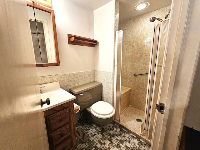 9616 Zimmer Dr, Algonquin, IL 60102 - full bath featuring vanity, a shower stall, tile walls, wainscoting, and tile patterned floors