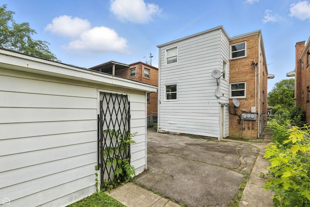 14526 Loomis Ave, Harvey, IL 60426 - rear view of property featuring a patio area and a storage shed