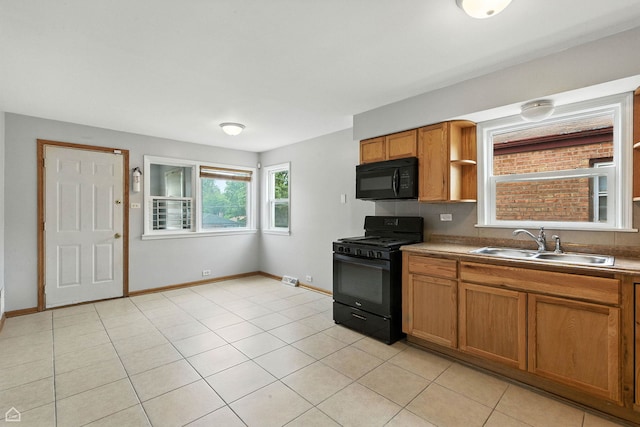 14526 Loomis Ave, Harvey, IL 60426 - kitchen featuring black appliances, brown cabinetry, and light tile patterned floors