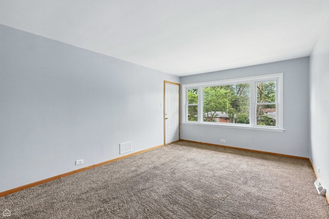14526 Loomis Ave, Harvey, IL 60426 - spare room featuring carpet floors and baseboards