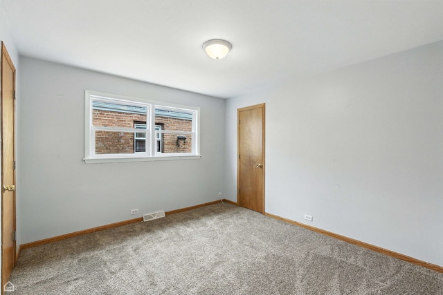 14526 Loomis Ave, Harvey, IL 60426 - spare room with carpet floors and baseboards