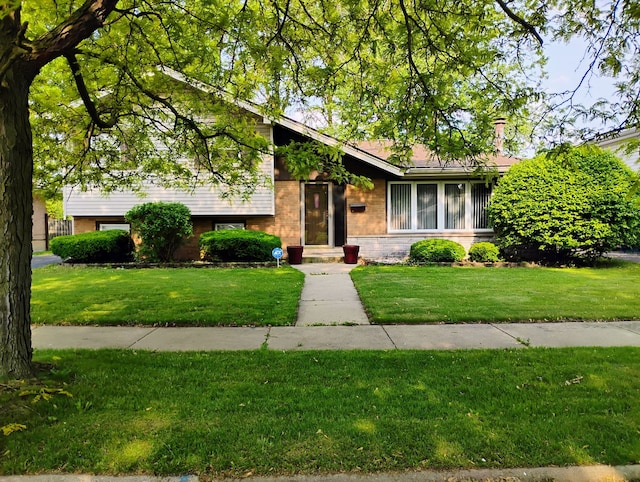 17028 Evans Dr, South Holland, IL 60473 - tri-level home featuring a front lawn and brick siding