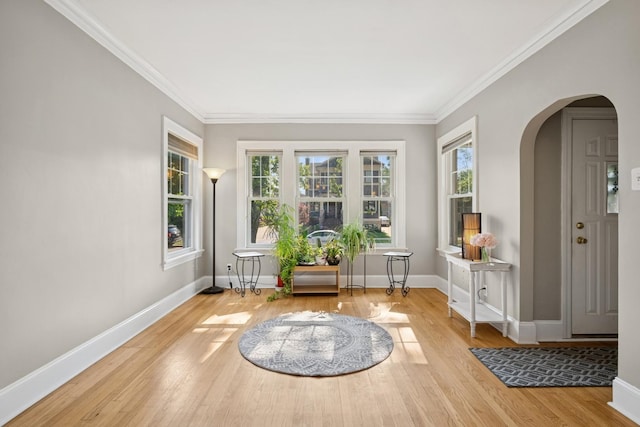 6912 N Osceola Ave, Chicago, IL 60631 - sitting room featuring wood finished floors, arched walkways, and crown molding