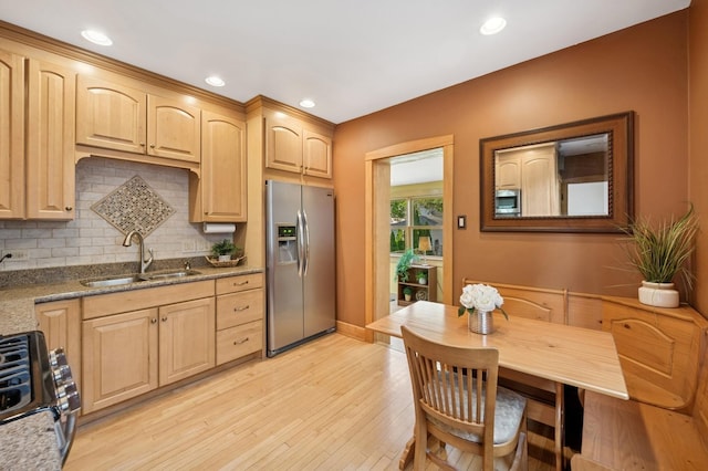 6912 N Osceola Ave, Chicago, IL 60631 - kitchen with stainless steel appliances, light brown cabinets, light wood-type flooring, backsplash, and stone counters