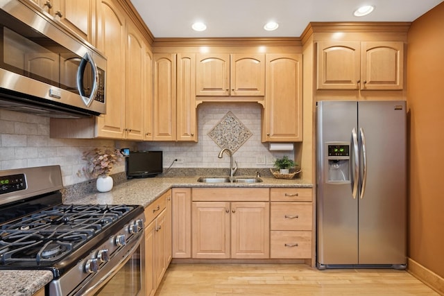 6912 N Osceola Ave, Chicago, IL 60631 - kitchen featuring appliances with stainless steel finishes, light brown cabinetry, light stone counters, and recessed lighting