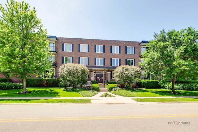 1350 N Western Ave Unit 106, Lake Forest, IL 60045 - view of front facade with a front lawn and brick siding