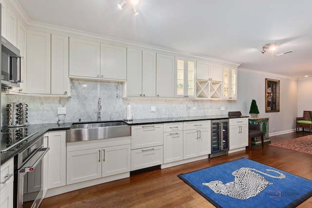1350 N Western Ave Unit 106, Lake Forest, IL 60045 - kitchen with beverage cooler, stainless steel oven, dark wood-style floors, dark countertops, and tasteful backsplash