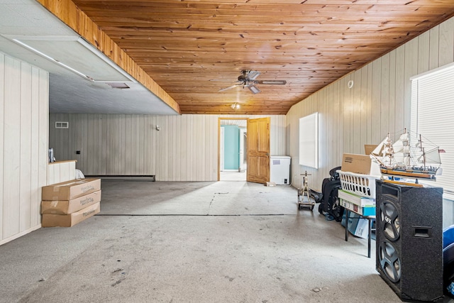 906 N State St, Marengo, IL 60152 - misc room with a ceiling fan and wooden walls