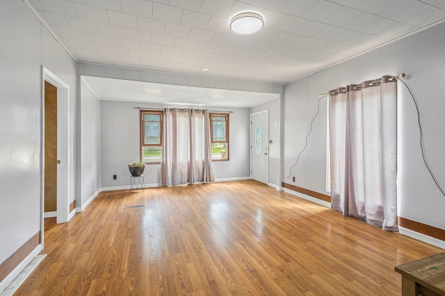 906 N State St, Marengo, IL 60152 - empty room featuring wood finished floors and baseboards