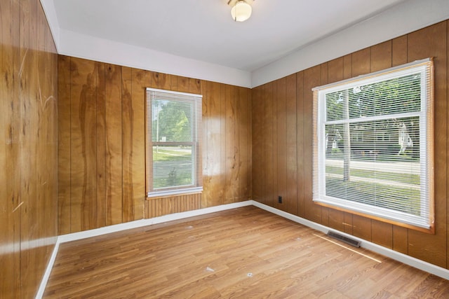 906 N State St, Marengo, IL 60152 - unfurnished room featuring light wood-style flooring and wood walls