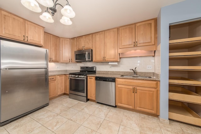 910 Persimmon Ln Unit B, Mount Prospect, IL 60056 - kitchen with stainless steel appliances, light stone countertops, light tile patterned flooring, a chandelier, and light brown cabinets