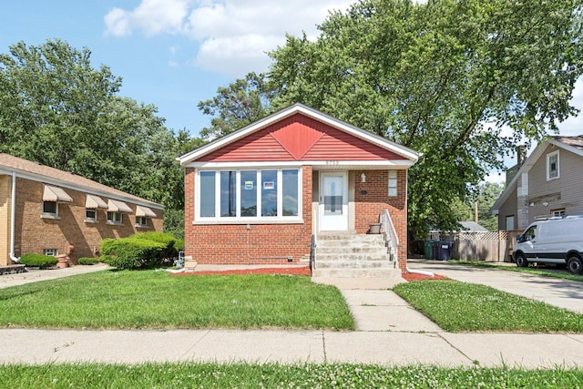 8753 S Troy Ave, Evergreen Park, IL 60805 - bungalow-style home with brick siding, crawl space, a front lawn, and entry steps