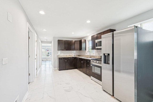 8753 S Troy Ave, Evergreen Park, IL 60805 - kitchen featuring stainless steel appliances, light marble finish floors, dark brown cabinets, light countertops, and recessed lighting