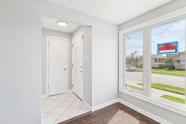 8753 S Troy Ave, Evergreen Park, IL 60805 - foyer featuring baseboards and light wood-style floors
