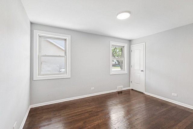 8753 S Troy Ave, Evergreen Park, IL 60805 - spare room featuring dark wood-style flooring
