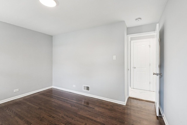 8753 S Troy Ave, Evergreen Park, IL 60805 - empty room with dark wood finished floors and baseboards