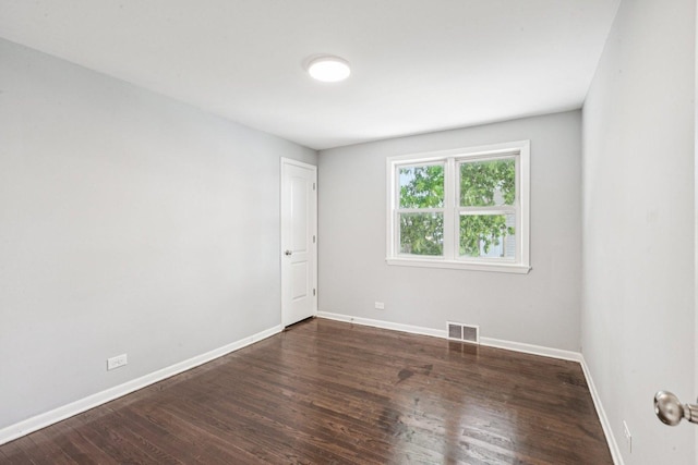 8753 S Troy Ave, Evergreen Park, IL 60805 - spare room with baseboards and wood finished floors
