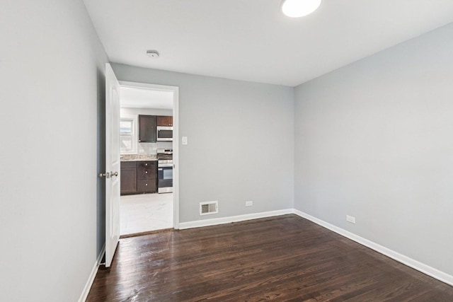 8753 S Troy Ave, Evergreen Park, IL 60805 - spare room featuring dark wood finished floors and a smoke detector