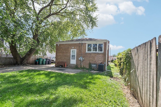 8753 S Troy Ave, Evergreen Park, IL 60805 - back of house featuring brick siding, a patio, and entry steps