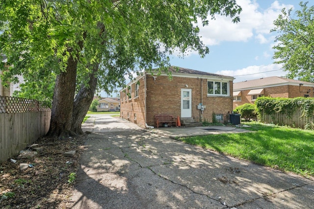 8753 S Troy Ave, Evergreen Park, IL 60805 - rear view of house featuring entry steps and brick siding
