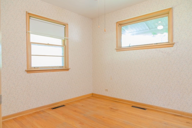 129 N Chase Ave, Bartlett, IL 60103 - empty room featuring light wood-type flooring and wallpapered walls