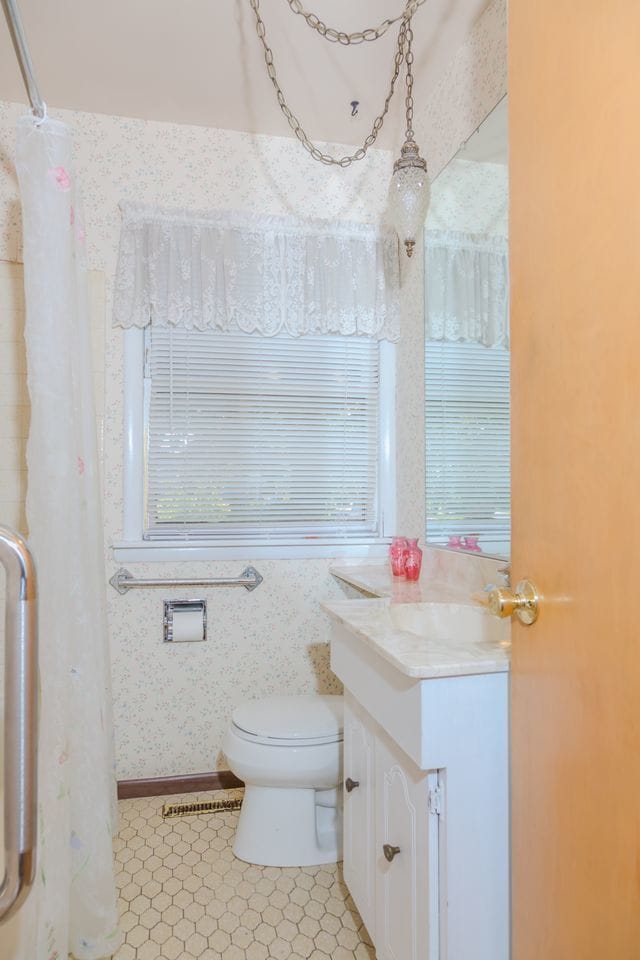 129 N Chase Ave, Bartlett, IL 60103 - bathroom featuring vanity, wallpapered walls, and tile patterned floors