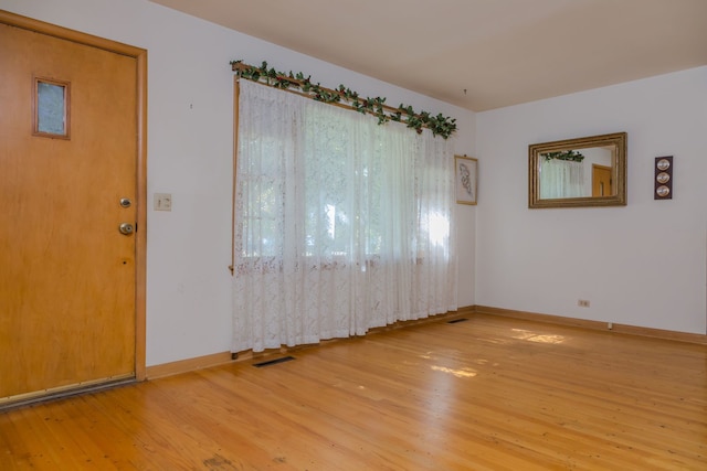 129 N Chase Ave, Bartlett, IL 60103 - empty room with light wood-style flooring and baseboards