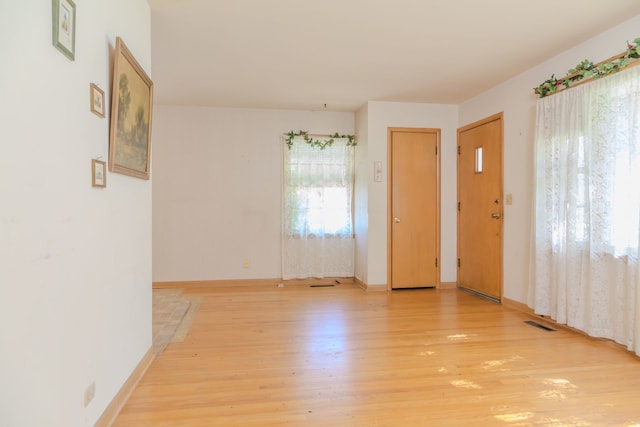 129 N Chase Ave, Bartlett, IL 60103 - empty room with light wood finished floors and baseboards