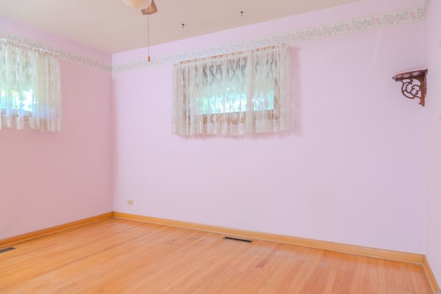 129 N Chase Ave, Bartlett, IL 60103 - unfurnished room featuring wood finished floors and baseboards
