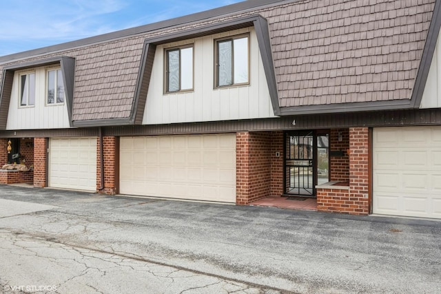4 Cour La Salle Ct, Palos Hills, IL 60465 - multi unit property with brick siding, mansard roof, an attached garage, and asphalt driveway