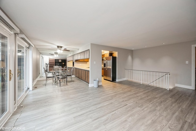4 Cour La Salle Ct, Palos Hills, IL 60465 - kitchen with stainless steel fridge with ice dispenser, open floor plan, light countertops, light wood-style floors, and ceiling fan