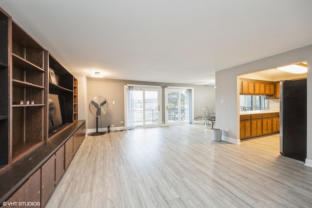 4 Cour La Salle Ct, Palos Hills, IL 60465 - unfurnished living room with light wood-style floors and baseboards