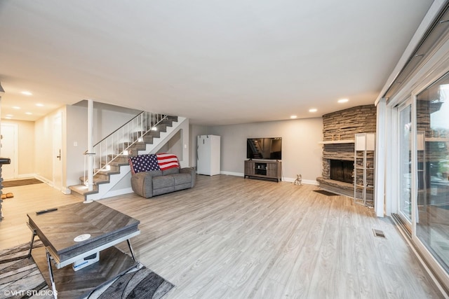 4 Cour La Salle Ct, Palos Hills, IL 60465 - living area with stairs, wood finished floors, a stone fireplace, and recessed lighting