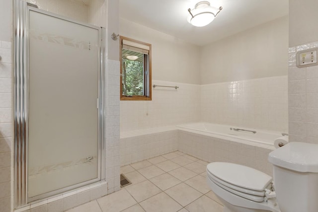 39081 N Sheridan Rd, Antioch, IL 60002 - bathroom featuring a bath, tile patterned floors, and a shower stall