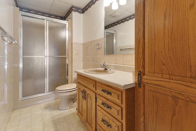 39081 N Sheridan Rd, Antioch, IL 60002 - full bath with vanity, a stall shower, and tile walls