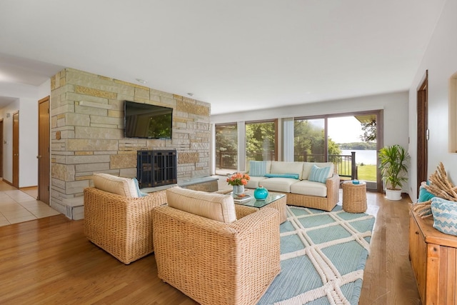 39081 N Sheridan Rd, Antioch, IL 60002 - living area with wood finished floors and a fireplace