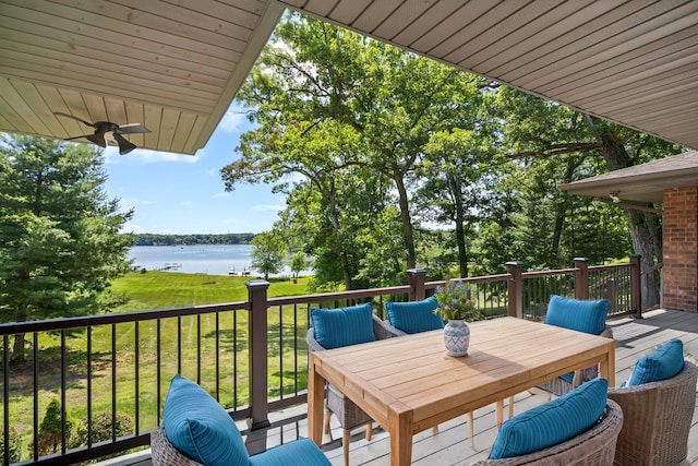 39081 N Sheridan Rd, Antioch, IL 60002 - wooden deck with a water view, a yard, outdoor dining area, and ceiling fan