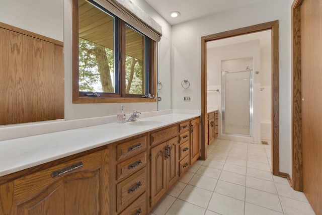 39081 N Sheridan Rd, Antioch, IL 60002 - bathroom featuring vanity, tile patterned flooring, and a shower stall
