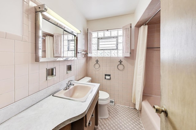 1927 Herbert Ave, Berkeley, IL 60163 - full bath featuring tile walls, vanity, shower / tub combo, and a wainscoted wall